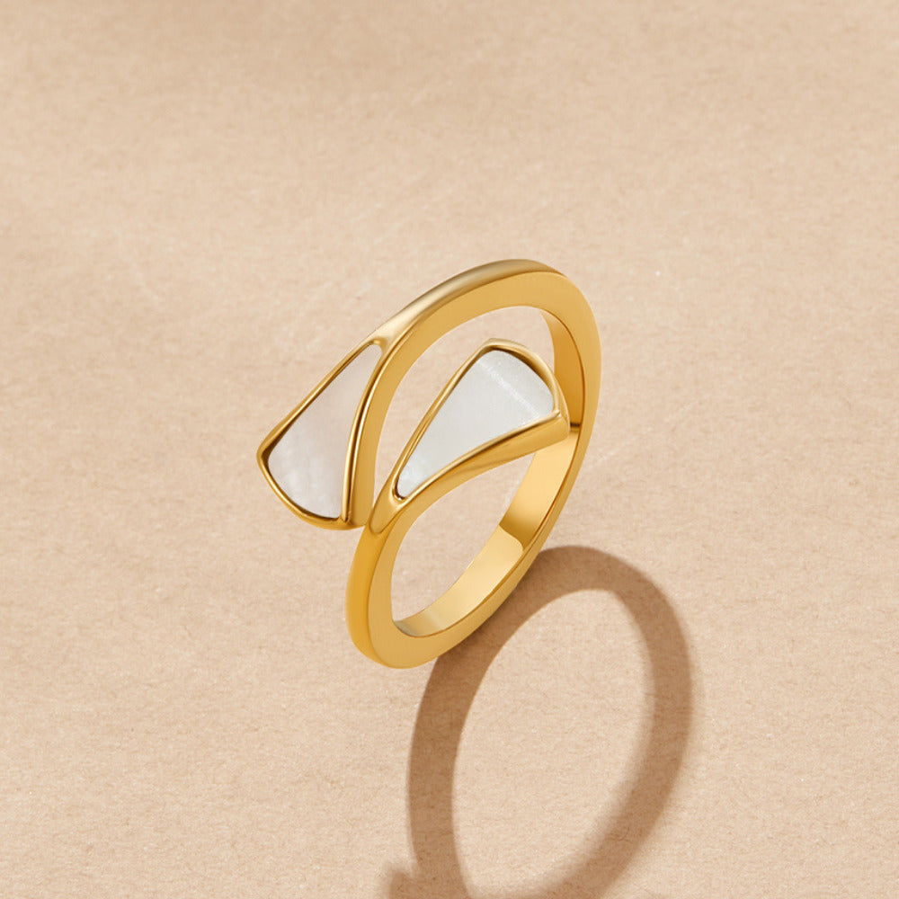 Mother Of Pearl Dream Ring, gold open ring with two triangular mother of pearl inlays, on a