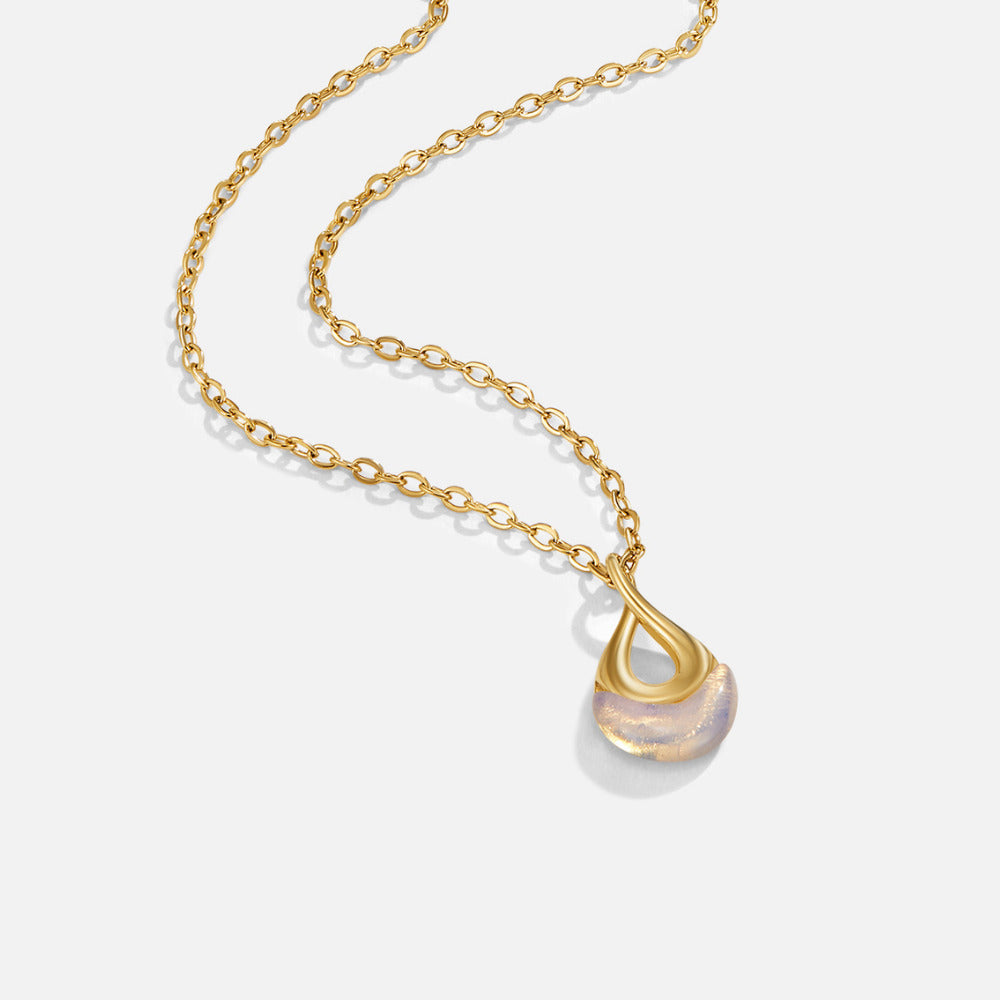 Tiffany White Stone Pendant Necklace, gold chain necklace on white, with a pale translucent
