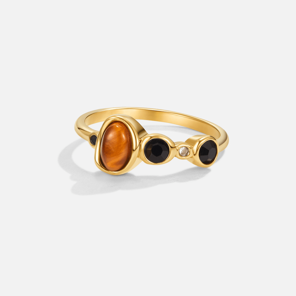 Aurora Vintage Crystal Ring, gold ring with an oval amber stone and black stones, on white