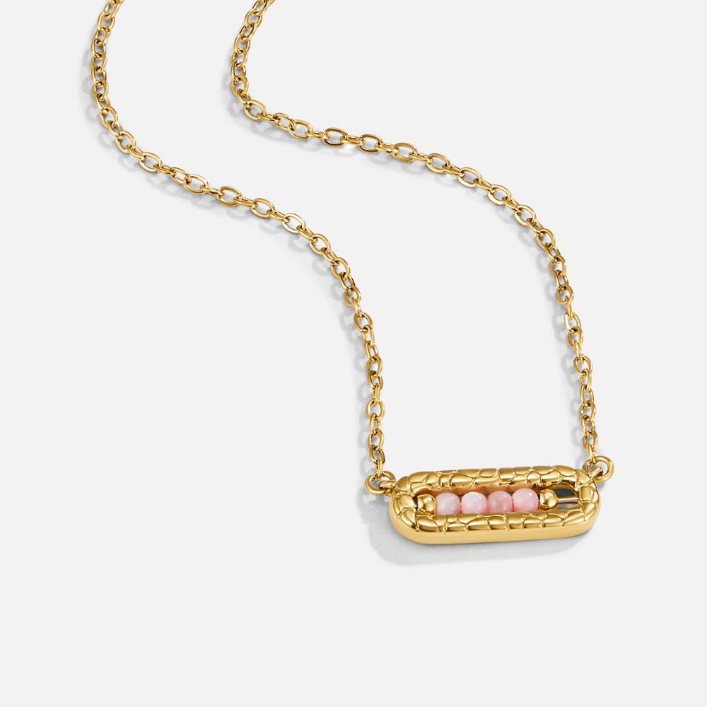 Blush Pink Bar Pendant Necklace, gold chain necklace with a textured bar pendant holding pink beads