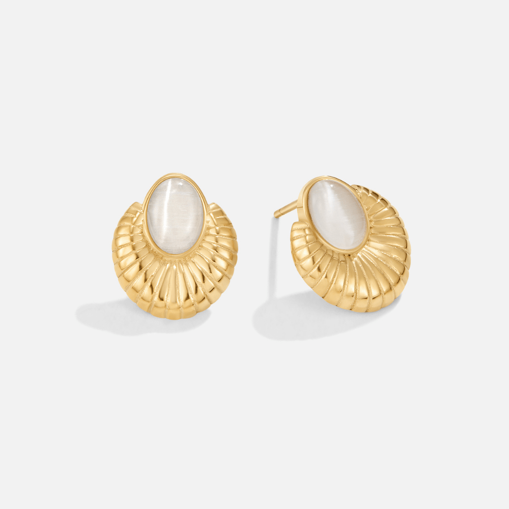 Bohemia Gold Cat Eye Earrings, pair of gold shell-shaped studs with white oval stones, on plain background