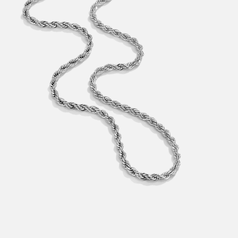 Calla Silver Twisted Chain Necklace, laid flat on white, curving in a loose S-shape