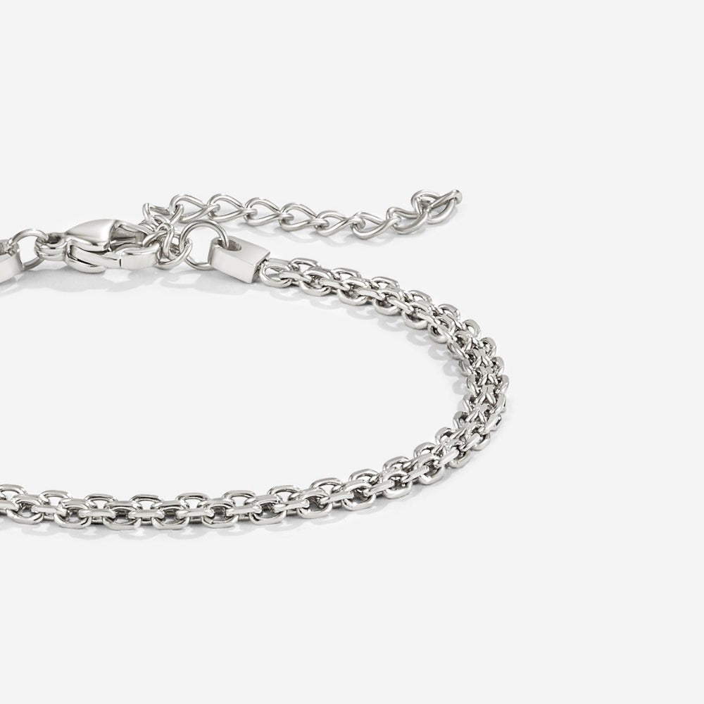 Capri Silver Chain Bracelet, close-up of a silver chain with lobster clasp and extender on white