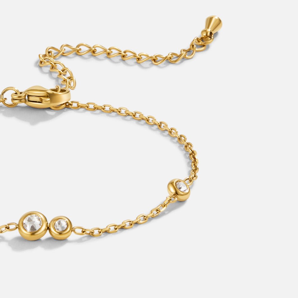 Celina Crystal Bracelet, close-up of gold chain bracelet with clear crystal stones and lobster clasp