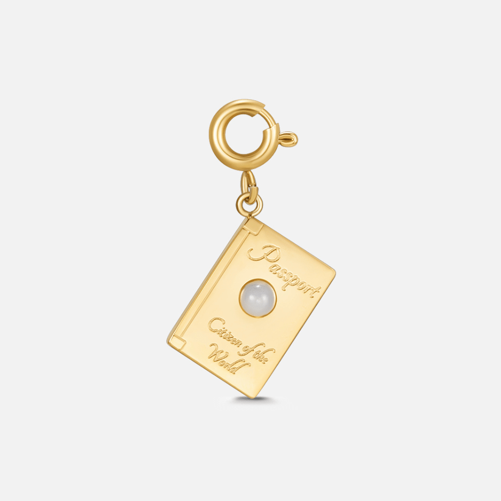 Citizen Of The World' Charm, gold passport-shaped charm with a pearl, on a spring clasp