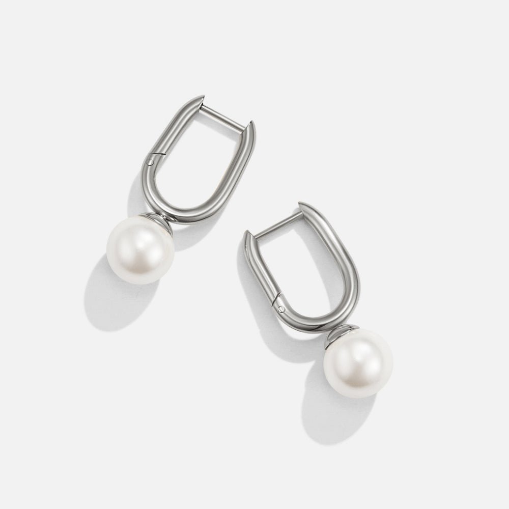 Cora Pearl Silver Hoop Earrings, pair of silver oval hoop earrings with white pearl drops on