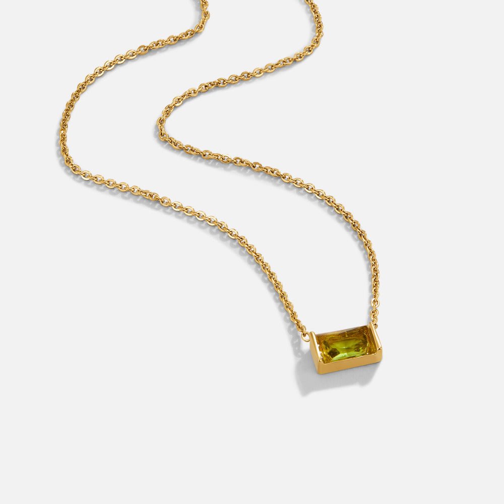 Crystal Peridot Pendant Necklace, gold chain necklace on white, green rectangular stone pendant