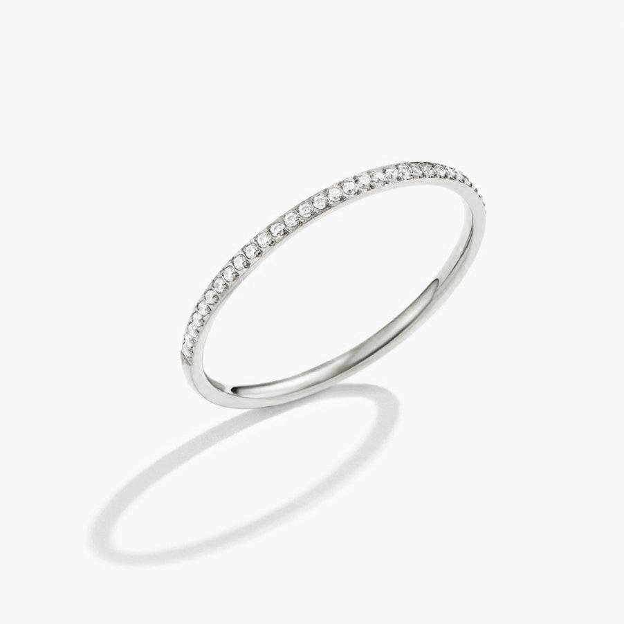 Silver Eternity Crystal Ring, standing ring on white background with a shadow, pavΓ© crystals
