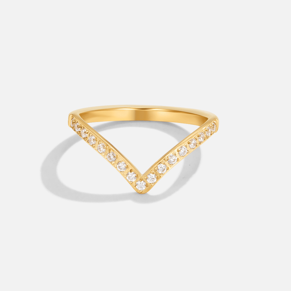 Eternity Crown Crystal Ring, chevron band in gold with small white stones, on plain background