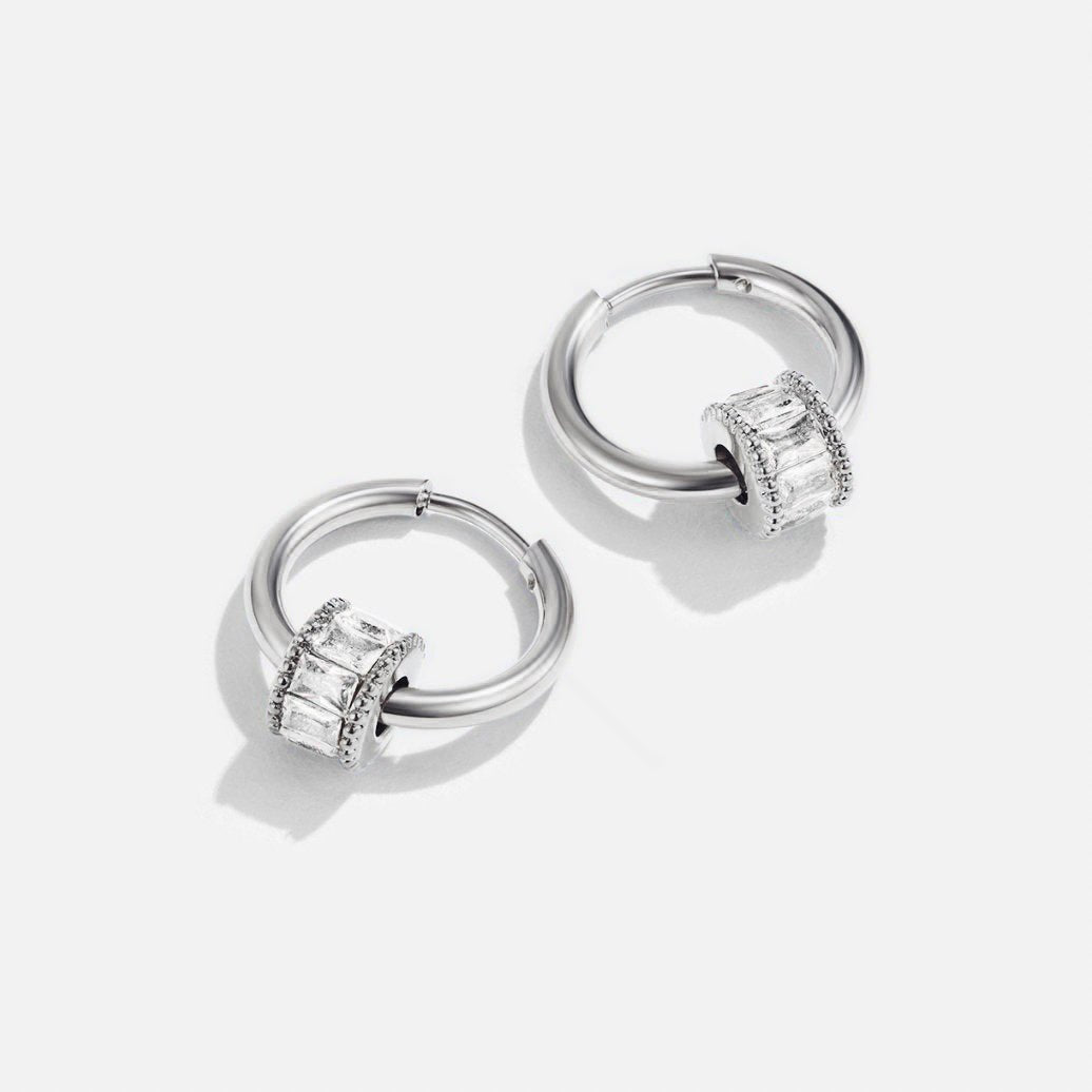 Gigi Crystal Silver Hoop Earrings, pair of silver hoops with baguette-stone charms on white