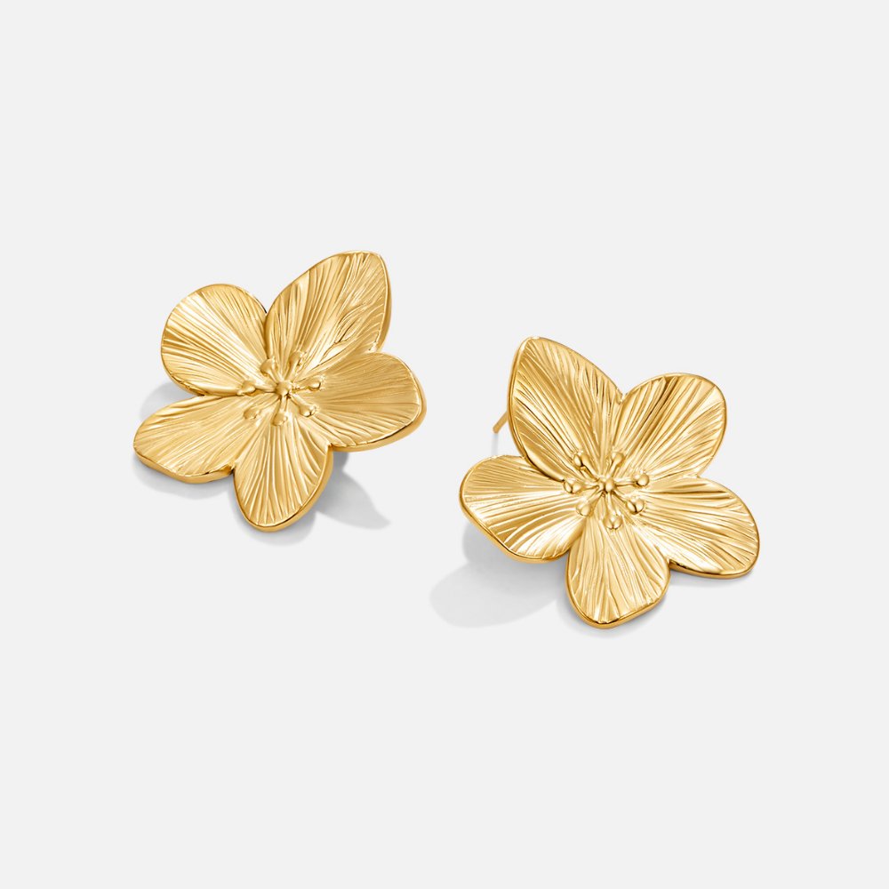 Gold Blossom Earrings, pair of gold flower stud earrings on a light grey background