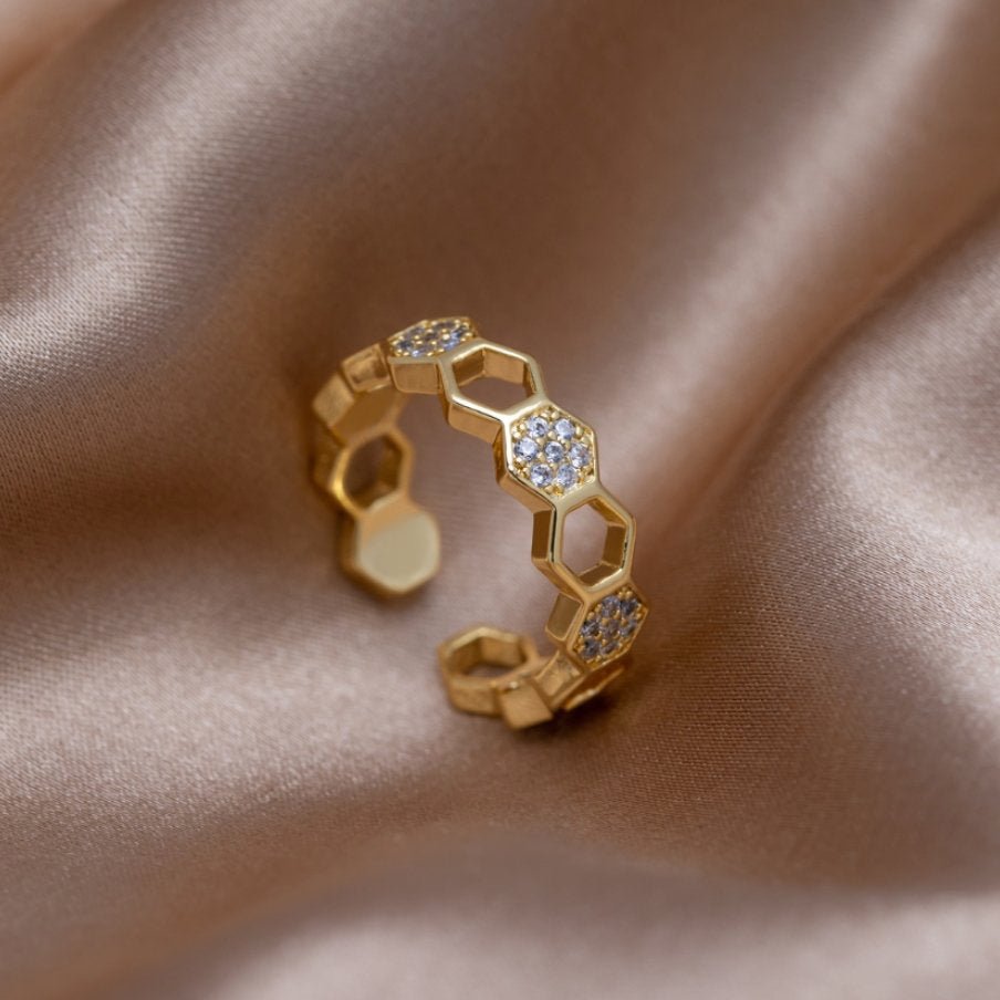 Gold & Crystal Honeycomb Ring, open gold ring with hexagon cells on satin, some set with stones