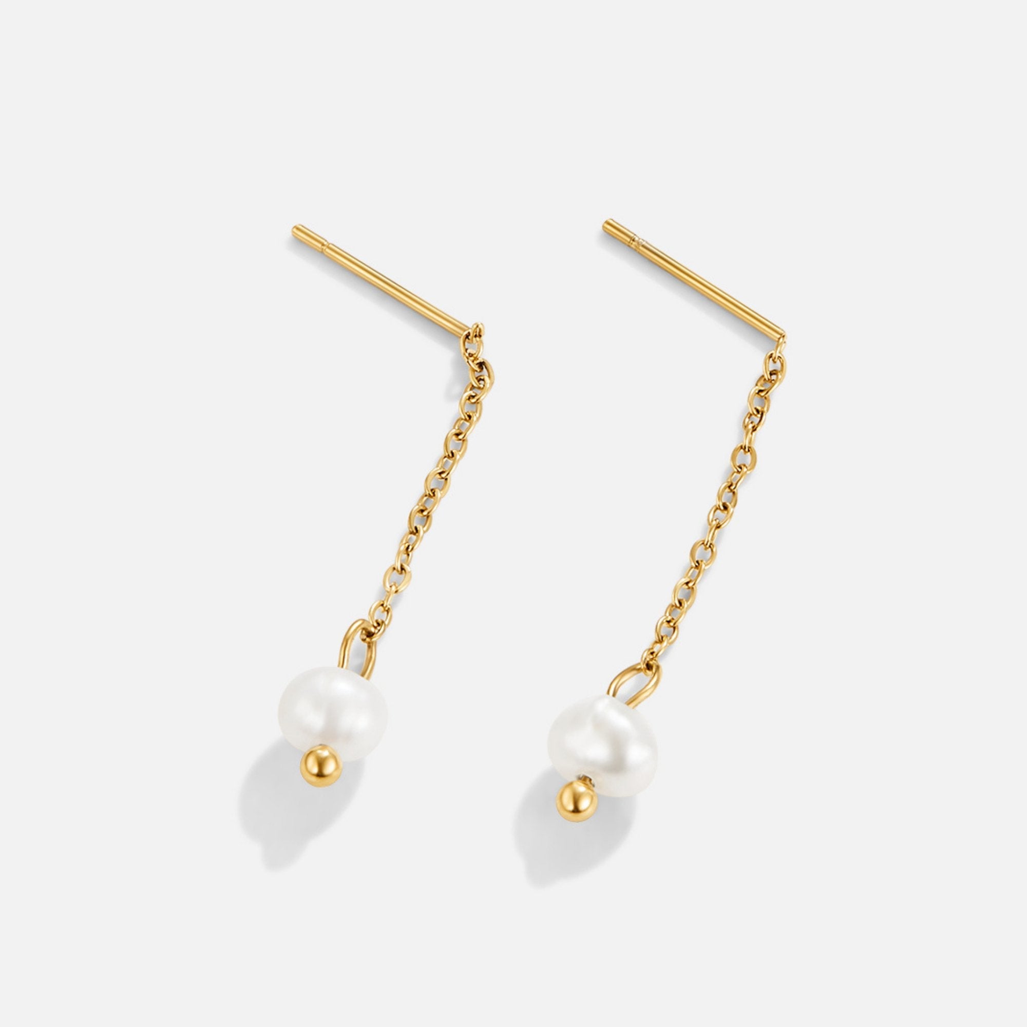 Gold Maria Pearl Drop Earrings, pair of gold chain drop earrings with pearls, on plain background