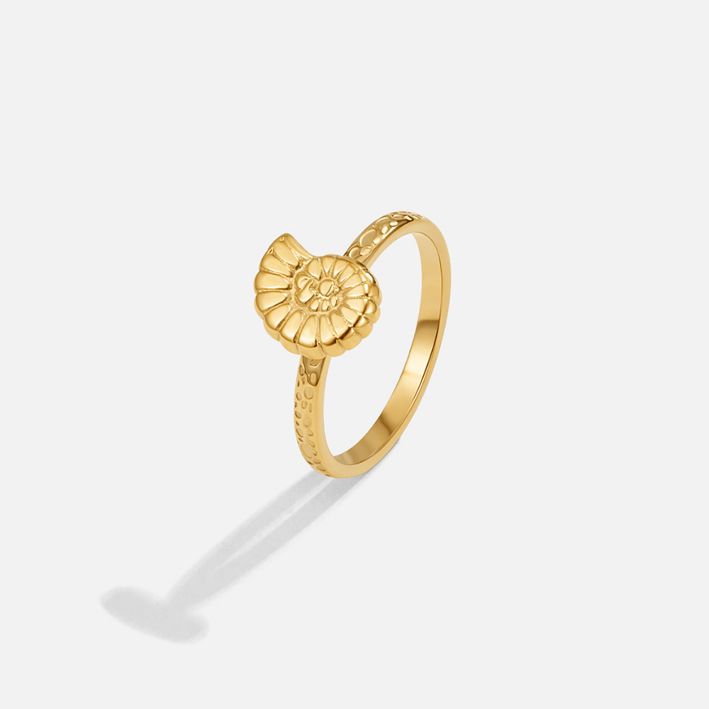 Golden Spiral Shell Ring, standing alone on white, gold ammonite-style shell top with textured
