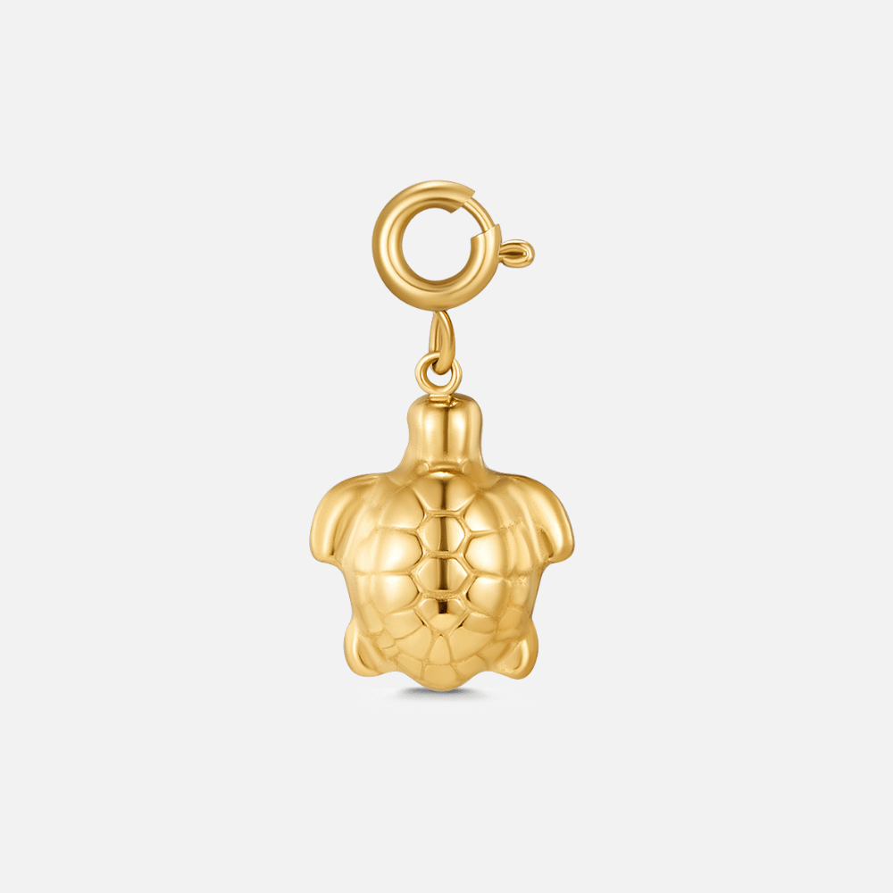 Golden Turtle Charm, gold turtle charm on a spring clasp, against a plain background