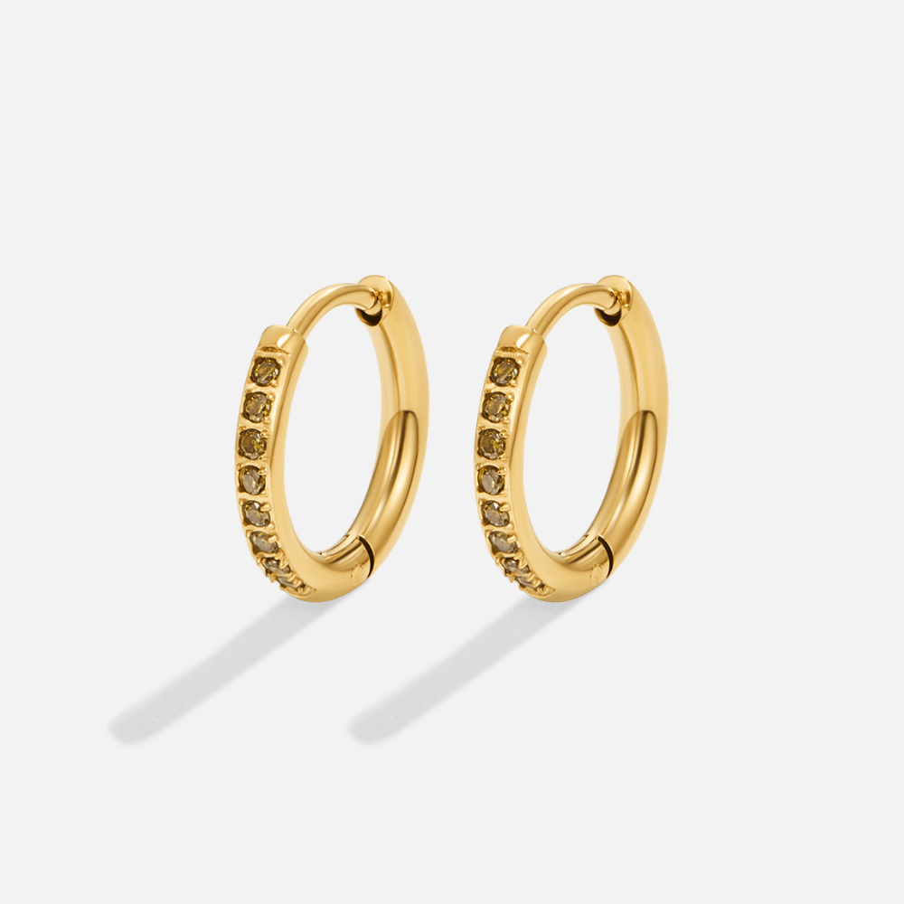 Green Eternity Hoop Earrings, pair of gold hoop earrings with small dark stones, on white