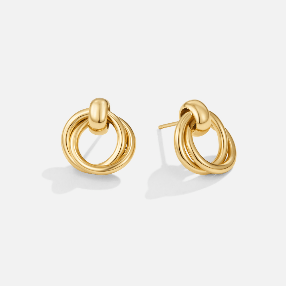 Juni Layered Hoop Earrings, pair of gold knot-style stud earrings on a plain white background