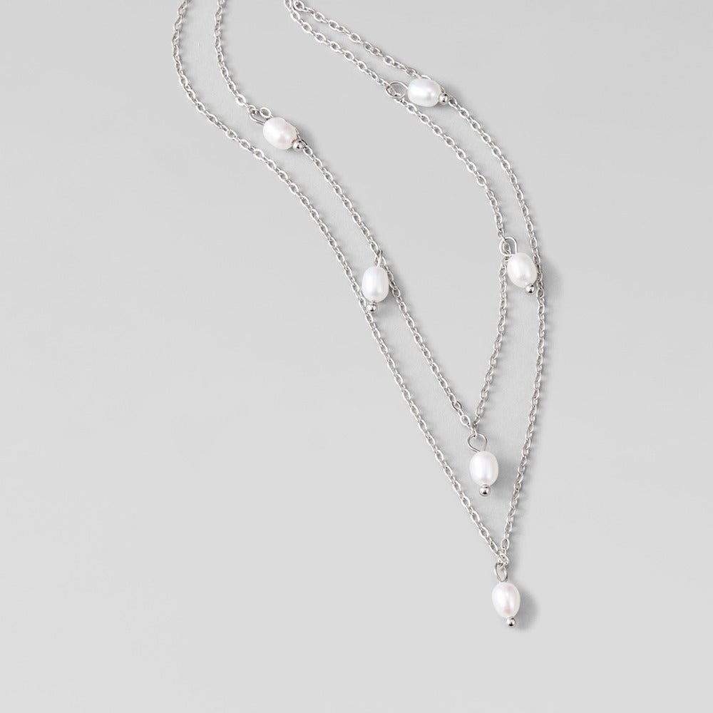 Kayla Pearl Drop Layered Silver Necklace, two layered silver chains with pearls, on light grey
