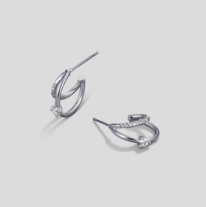 Layered Crystal Silver Hoop Earrings, pair of earrings on plain grey background, side view