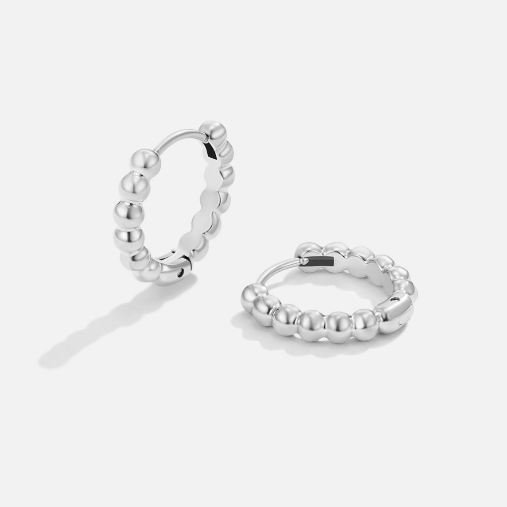 Leona Silver Bead Hoop Earrings, pair of silver hoops with beaded edges on a plain white background