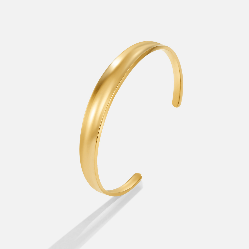 Leyla 18K Gold Bangle, gold cuff bangle, open at the bottom, on a plain white background
