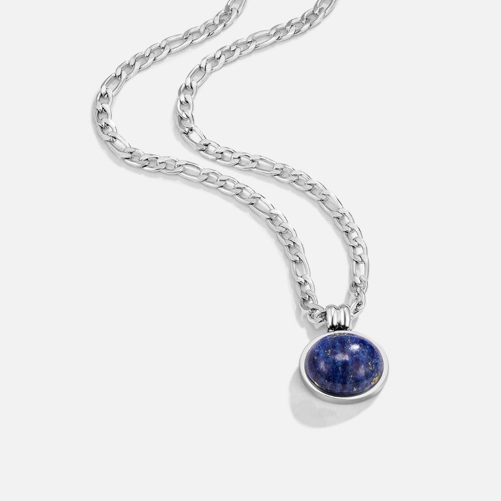 Liza Lapis Lazuli Silver Necklace, silver figaro chain with round blue stone pendant on white