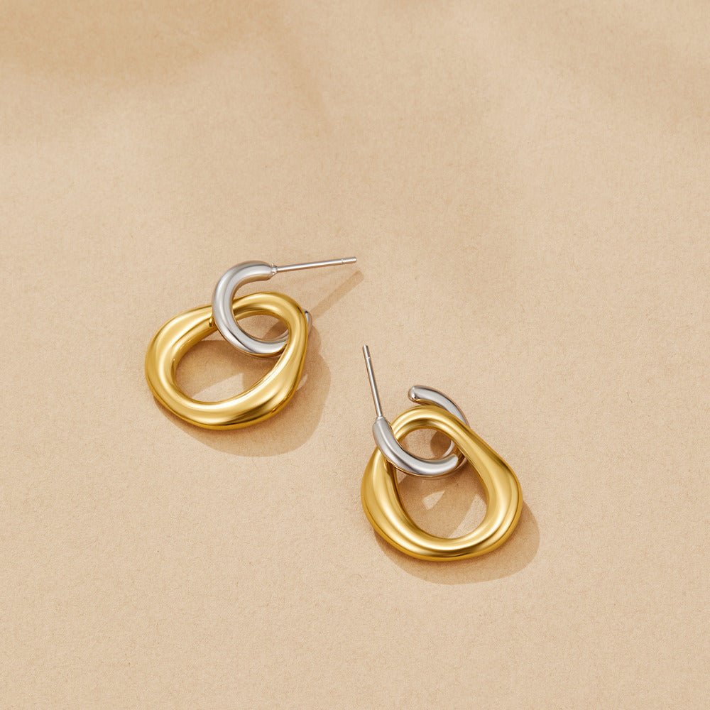 Lola Layered Drop Hoop Earrings, a pair of earrings lying flat on a beige surface, gold and