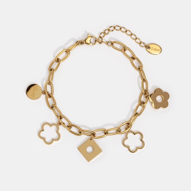 Lucky Daisy Charm Bracelet, flat lay of gold chain bracelet with flower and square charms