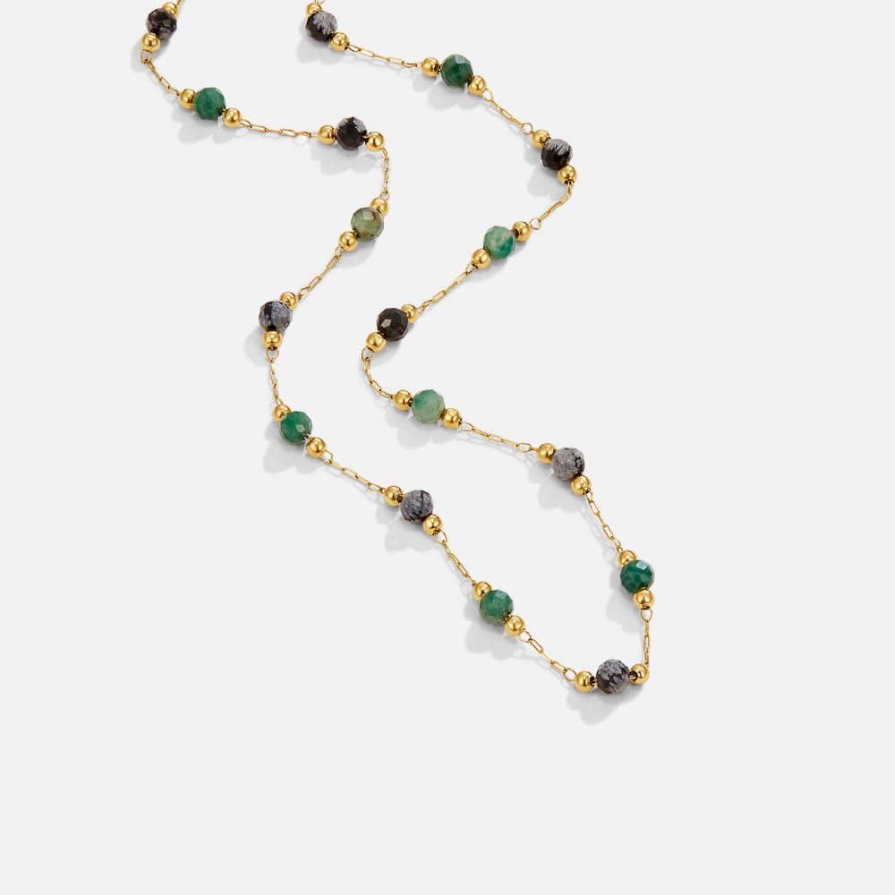Lulu Forest Beaded Stone Necklace, flat lay of a gold chain with green and grey faceted stones