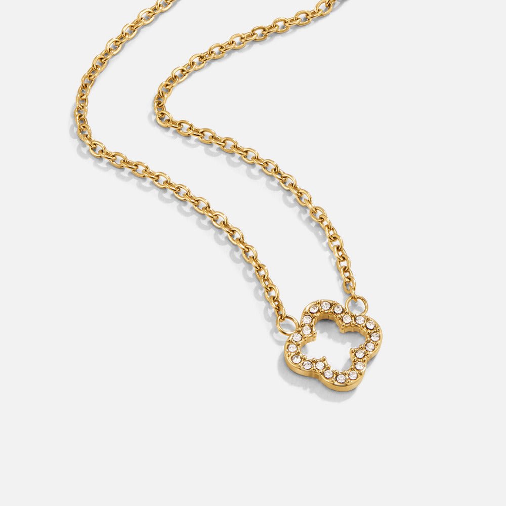 Luxe Crystal Clover Necklace, gold chain necklace on white, clover pendant set with clear