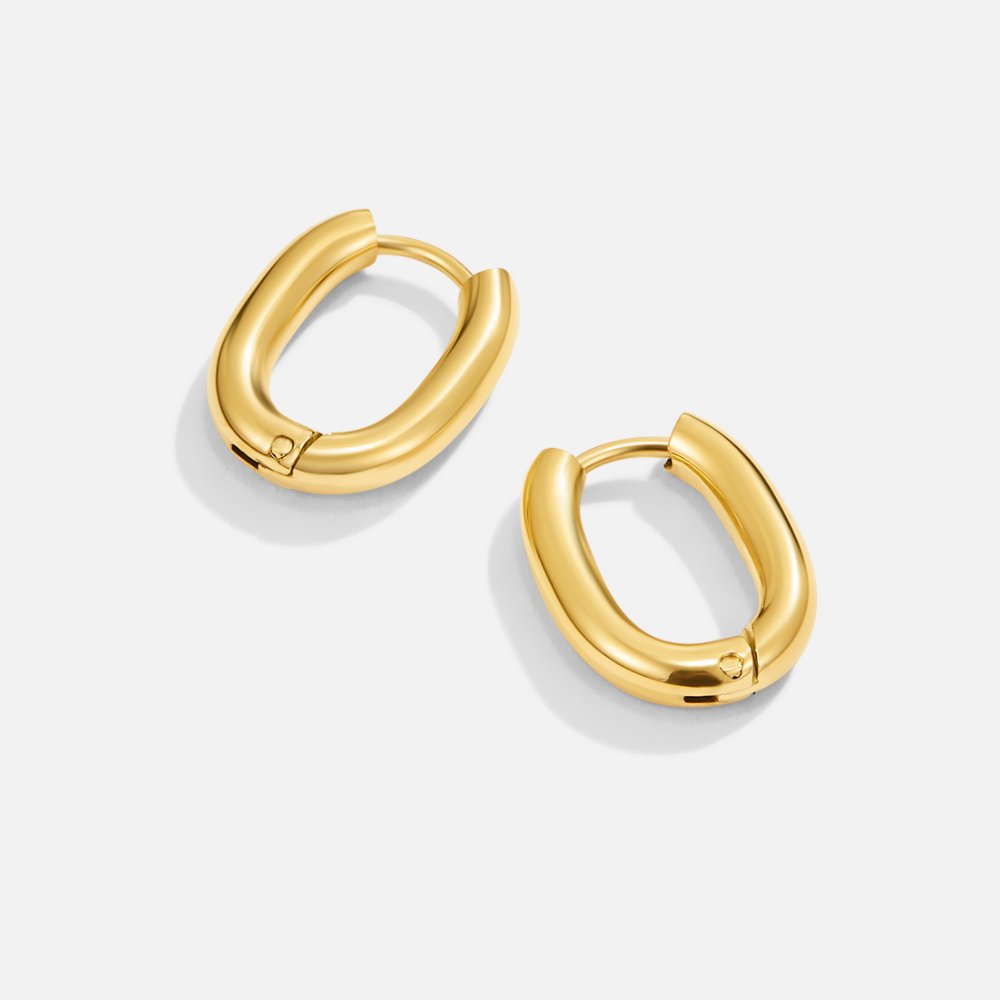 Madison Gold Hoop Earrings, pair of glossy gold oval hoop earrings on a white background