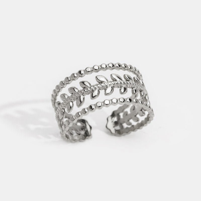 Marissa Layered Silver Leaf Ring, open band ring on white background, leaf vine between beaded