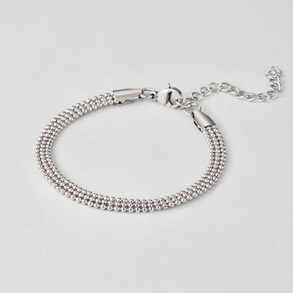 Milan Silver Beaded Chain Bracelet, laid flat on grey, lobster clasp and extender chain