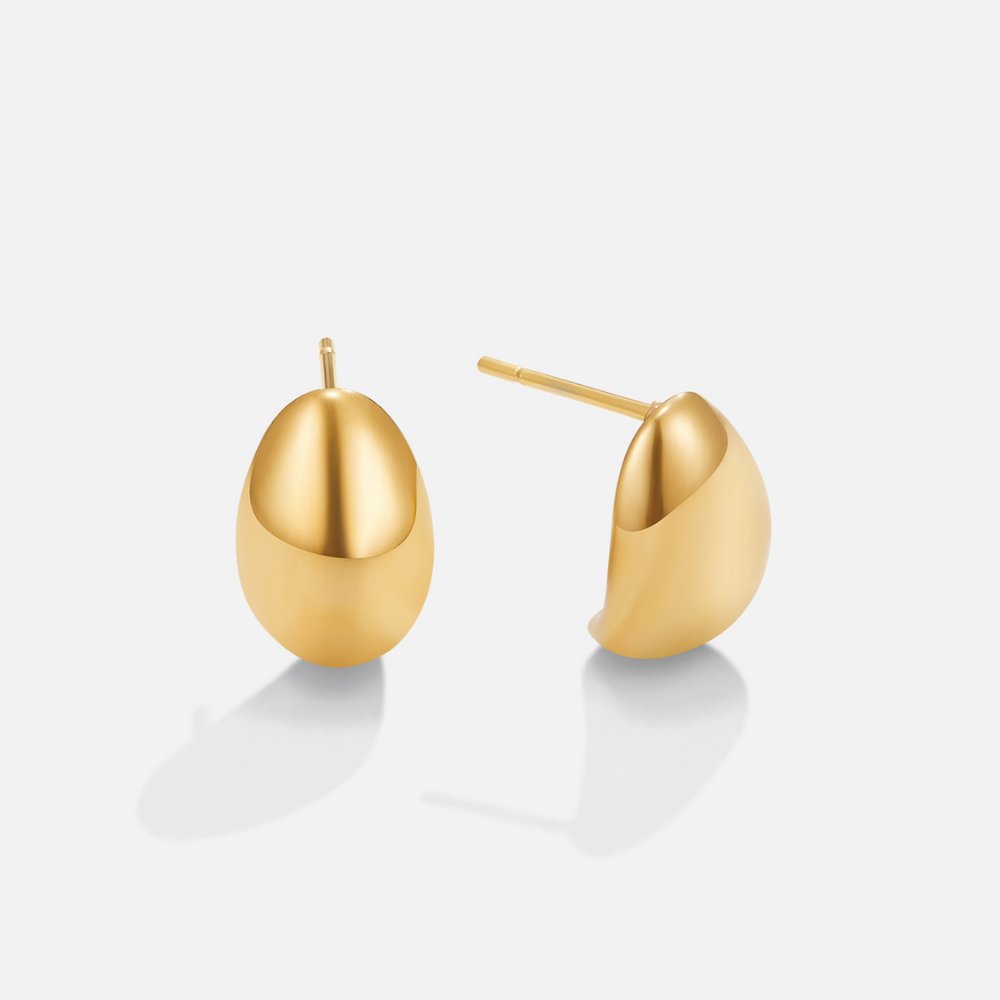 Mini Curve Earrings, pair of polished gold dome earrings on a plain white background