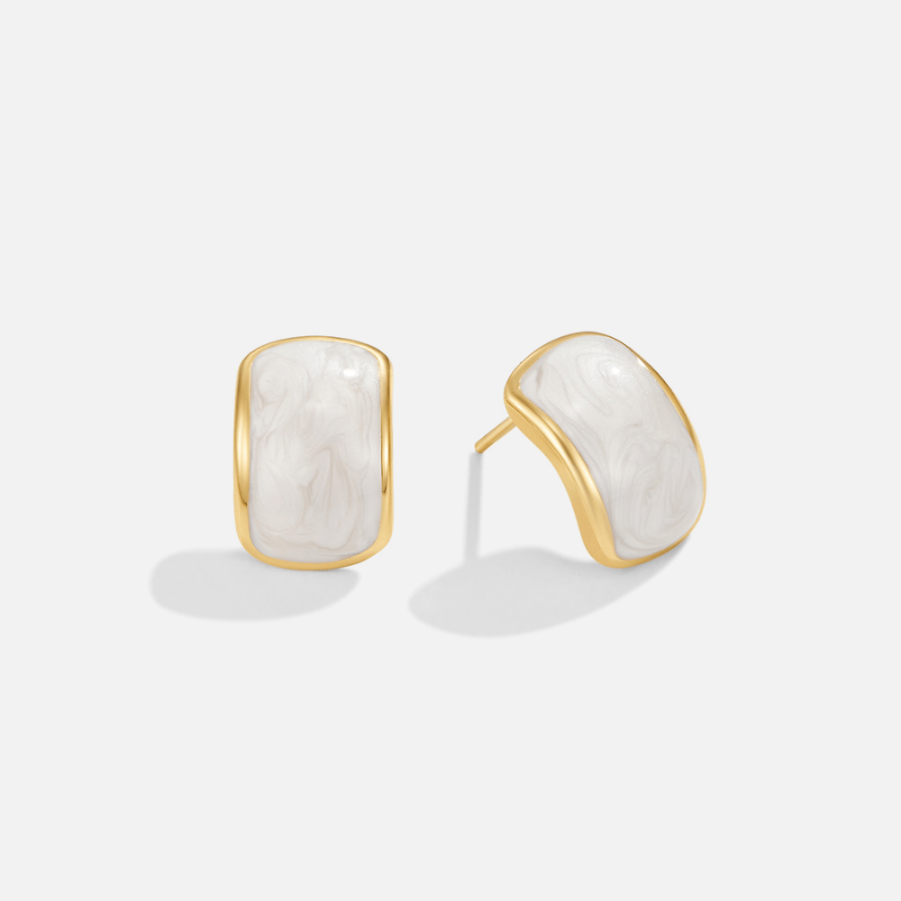 Mother Of Pearl Semi Hoop Earrings, pair of gold-rimmed white marbled stud earrings on white background