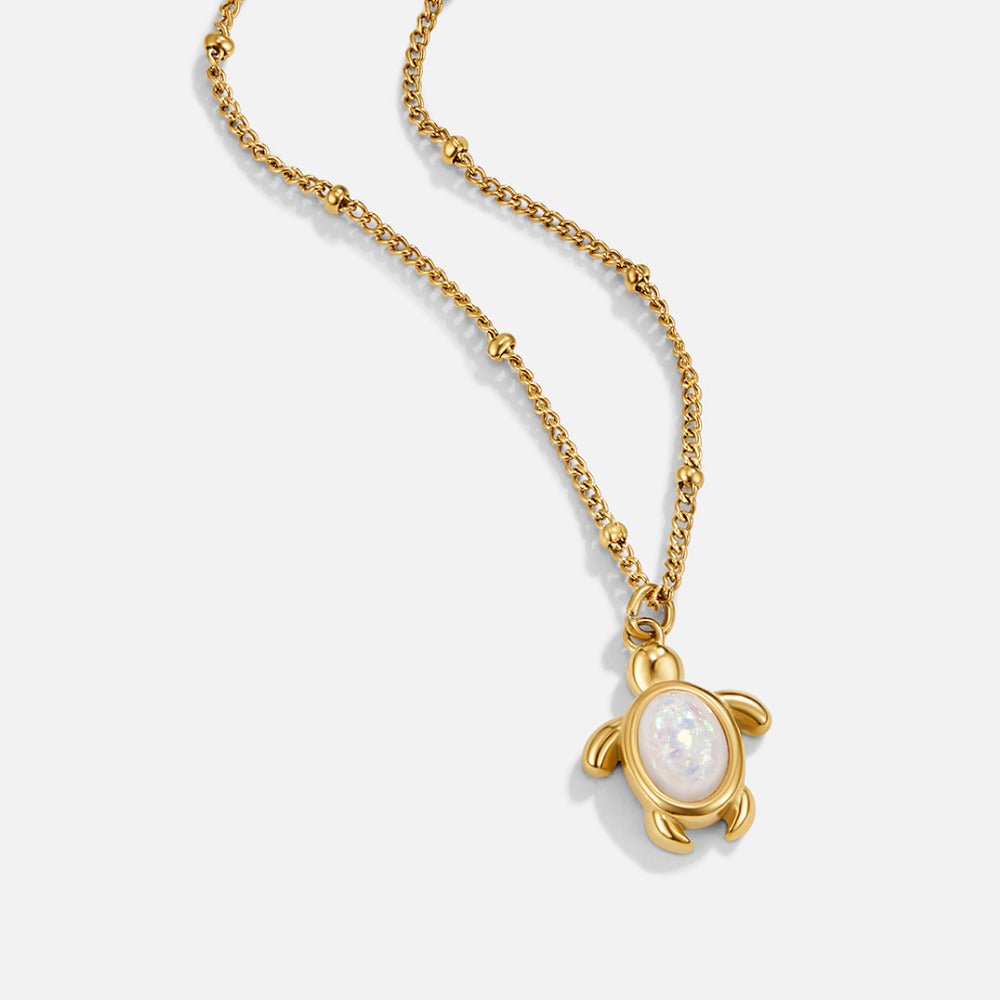 Opal Gold Turtle Pendant Necklace, gold chain necklace with a turtle pendant set with a white opal