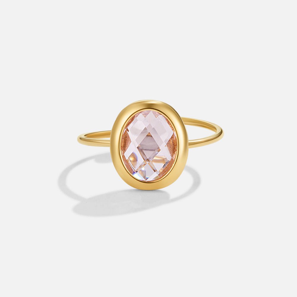 Pink Rose Crystal Gold Ring, standing alone on white, oval pale pink faceted stone in gold setting