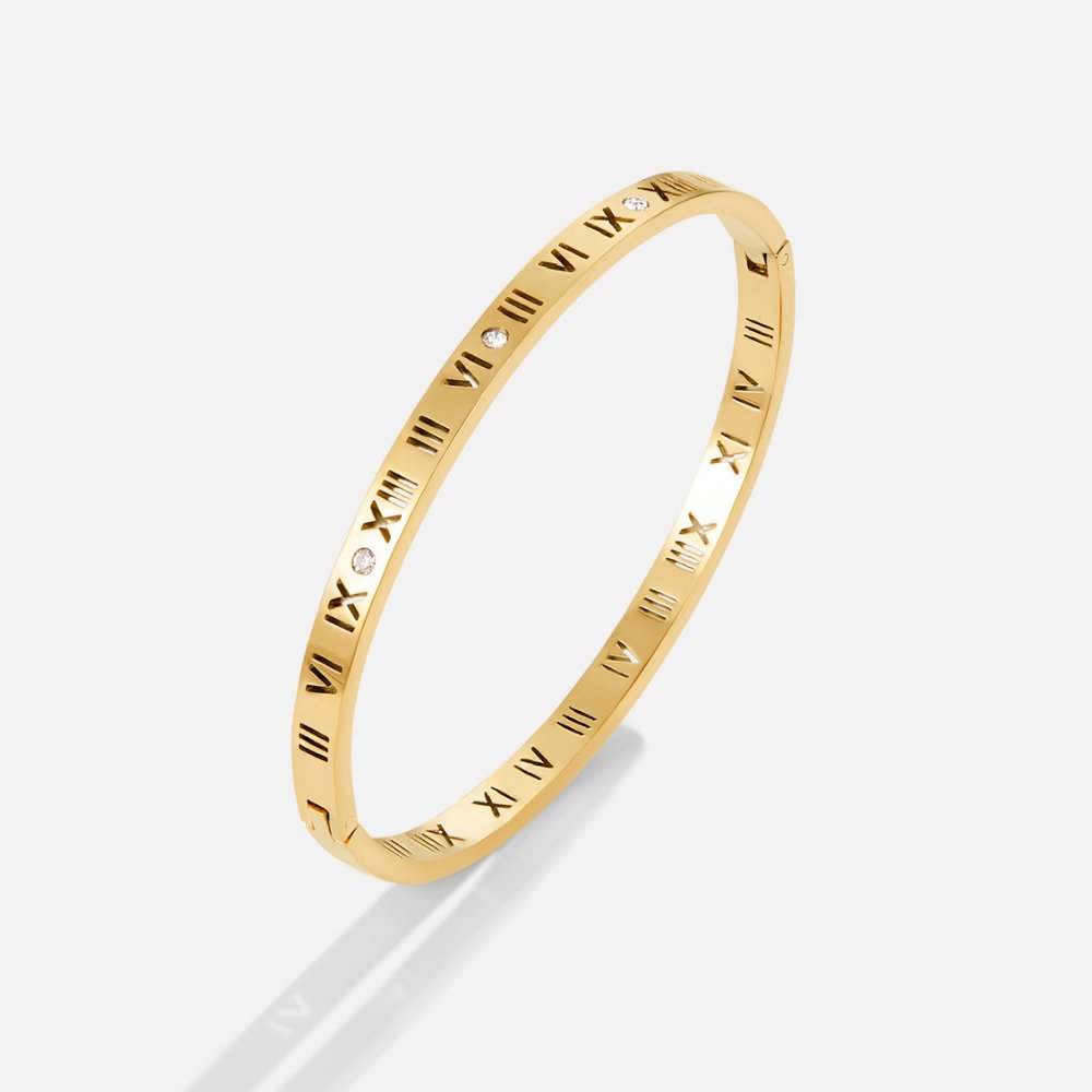 Roman 18K Gold Bangle, gold bangle with Roman numerals and small crystals, on white background