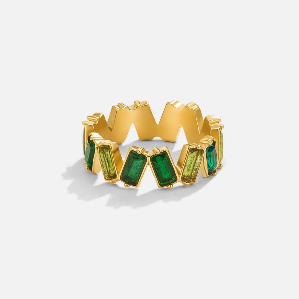 'Sapphire Dream' Crystal Baguette Ring, standing ring on white background with green baguette