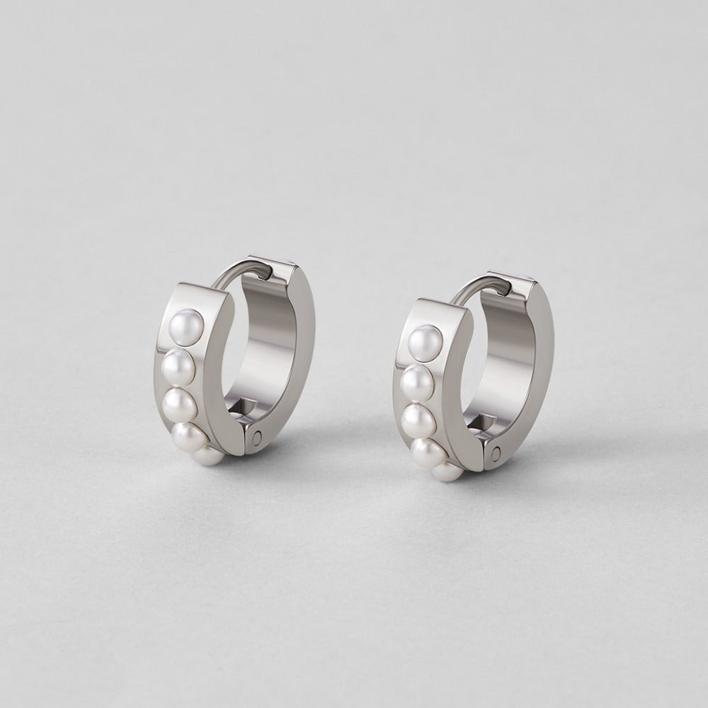 Silver Eula Pearl Hoop Earrings, pair of silver hoops with a row of small pearls, on grey