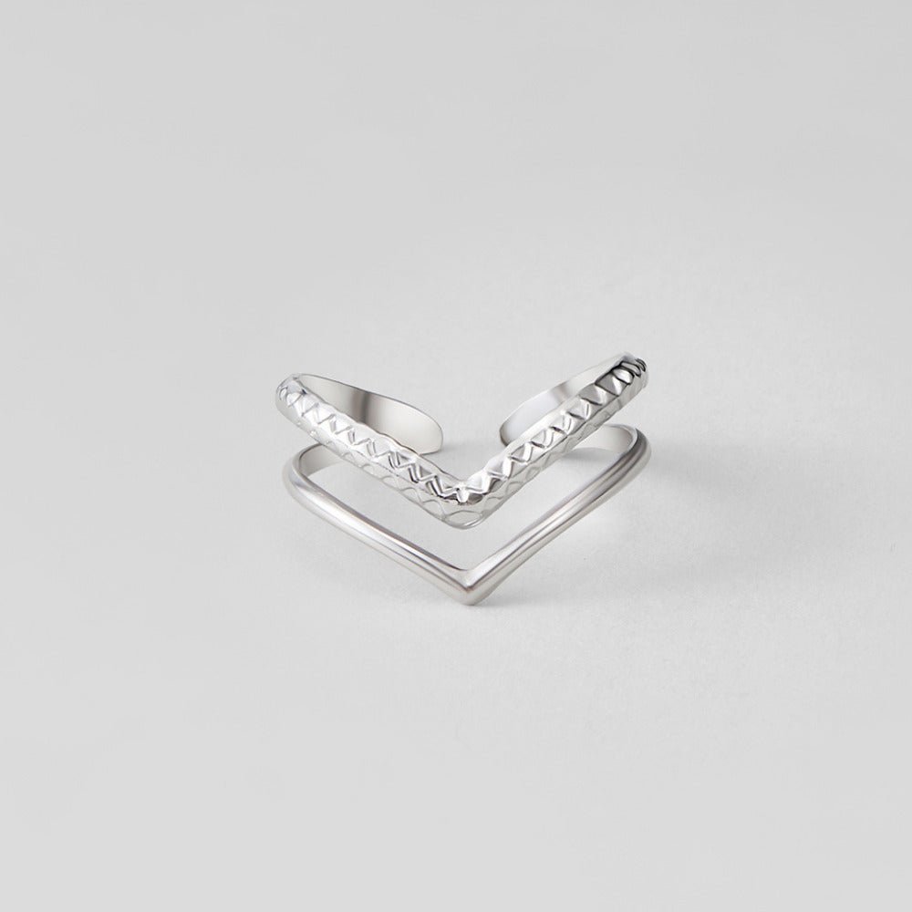 Silver Harper Layered Wrap Ring, two chevron-shaped silver rings stacked on a plain grey