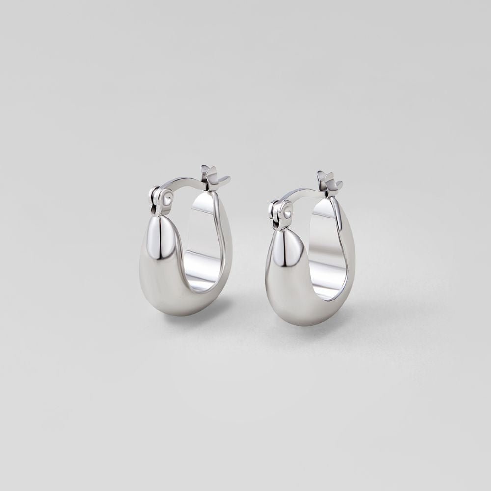 Silver Serenity Hoop Earrings, pair of polished silver hoops on a plain grey background