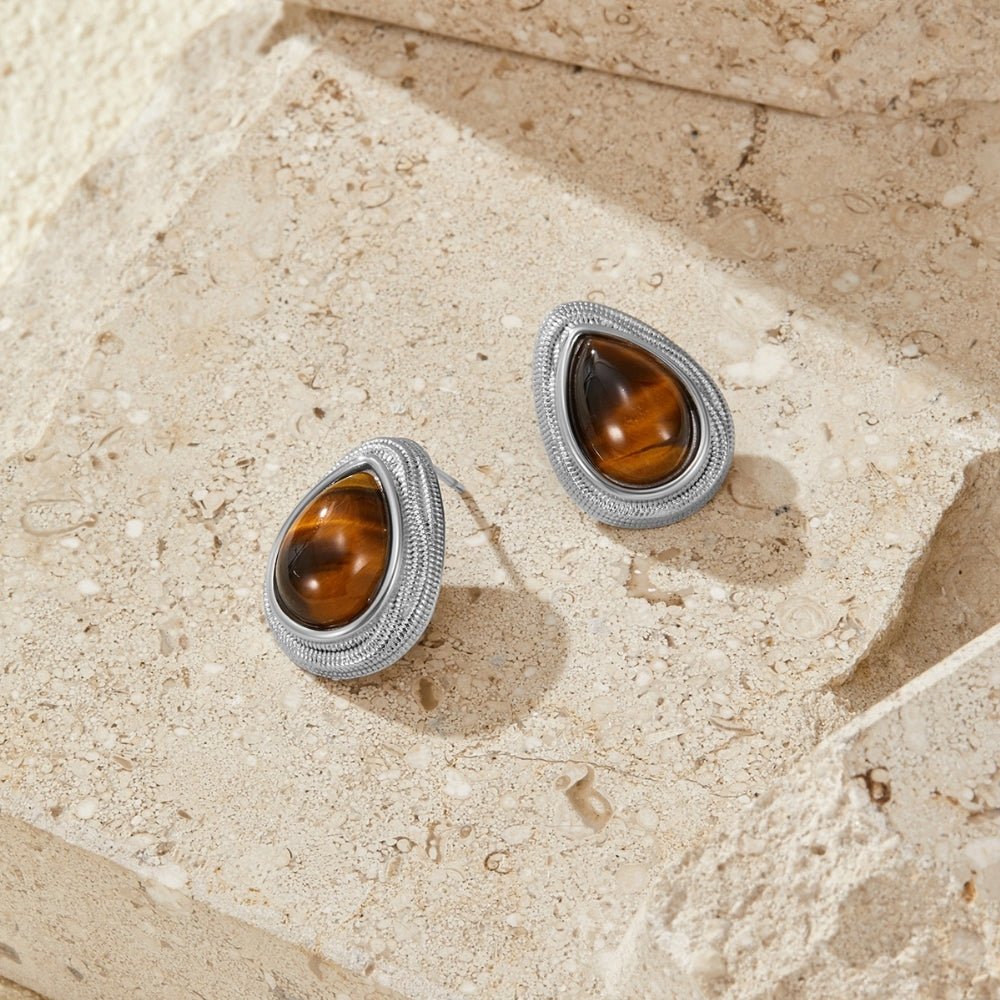 Silver Tiger Eye Teardrop Earrings, pair of teardrop earrings on textured stone, brown tiger