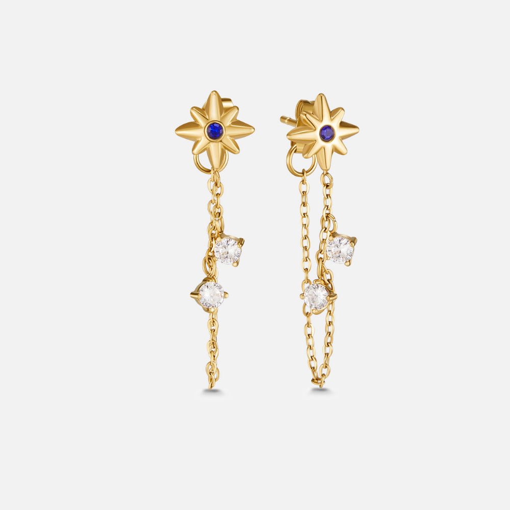 Starburst Crystal Drop Earrings, pair of gold star earrings with blue centres and dangling chains