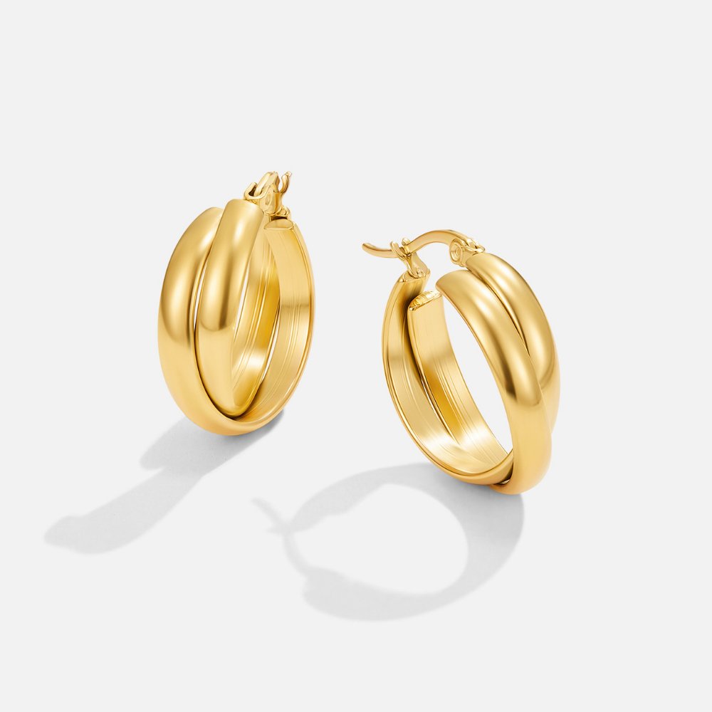 Talia Gold Hoop Earrings, pair of gold hoop earrings on a plain white background