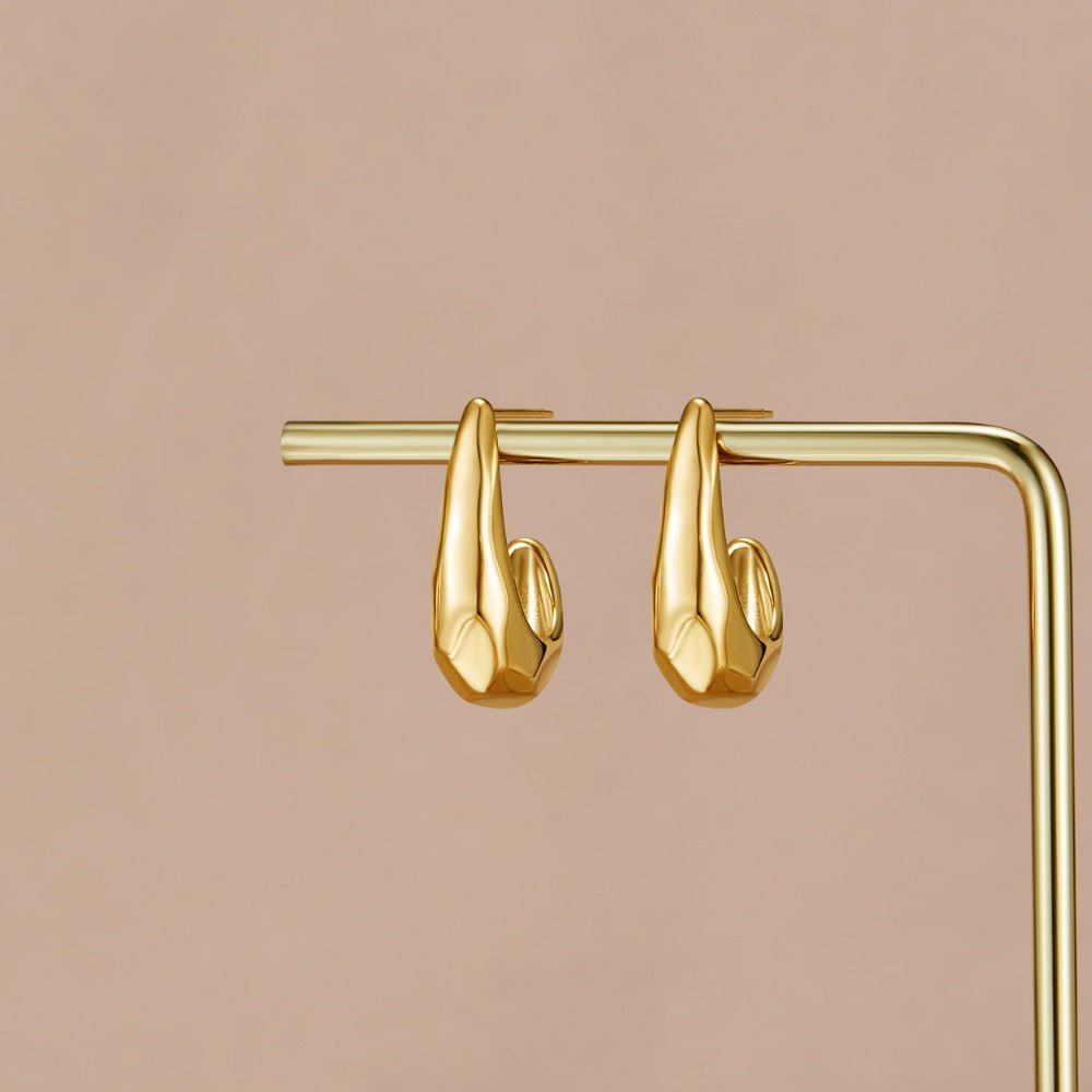 Vienna Gold Dome Earrings, two gold hoop earrings hanging on a gold display stand