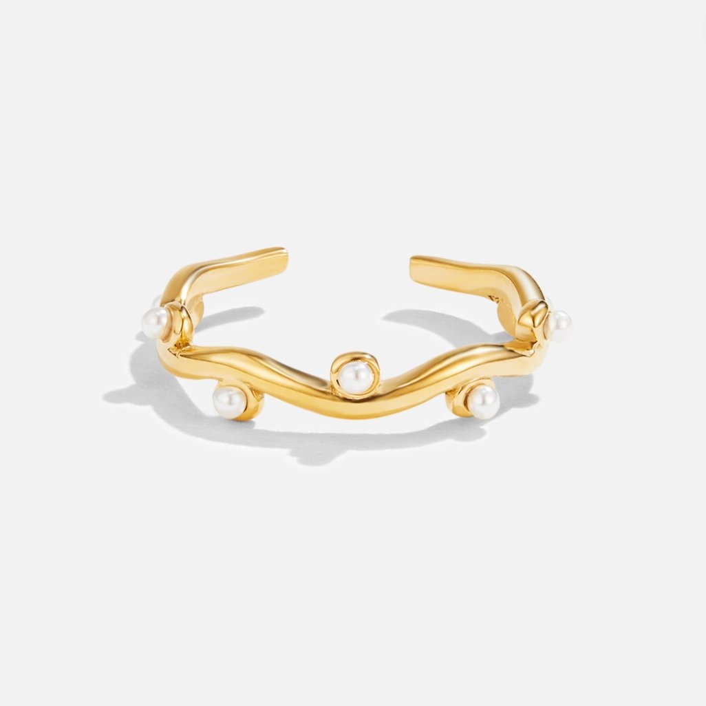 Wavey Pearl 18K Gold Ring, flat on white, open wavy band with small pearls set along it