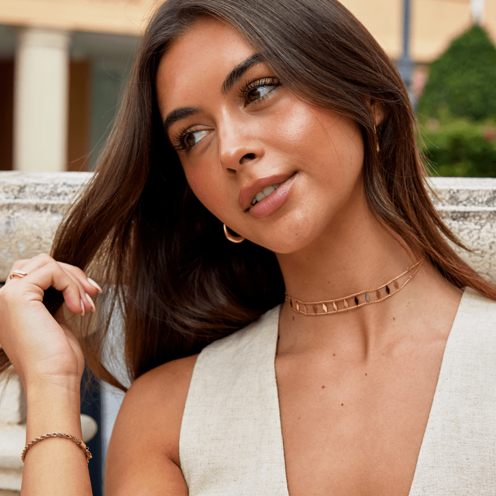 Zara Gold Choker, worn at the neck with hoop earrings and a bracelet, rose gold tone