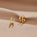 18K Gold & Crystal Claw Earrings, pair of gold double-hoop earrings with crystal inlay on
