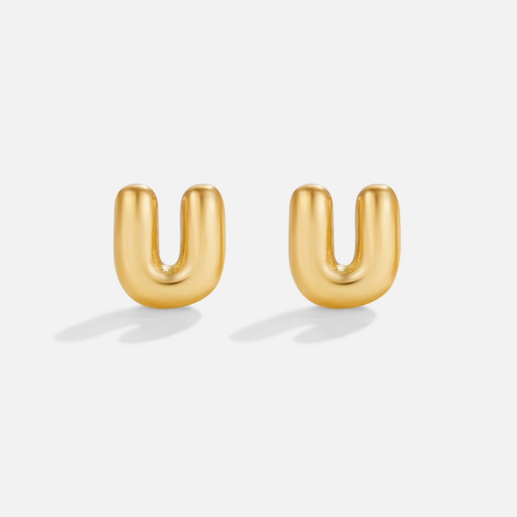 Gold Bubble Letter Earrings, pair of puffy gold letter U studs on a plain light background